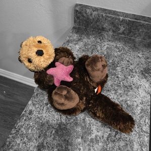 Brown and Tan Plush Otter Toy with Pink Star